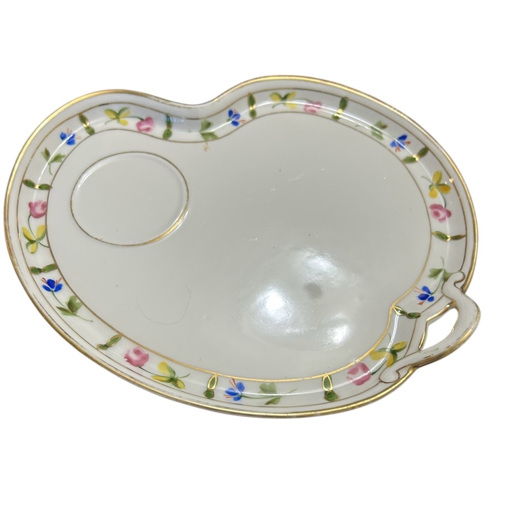 vintage porcelain item is a kidney-shaped snack or luncheon plate,